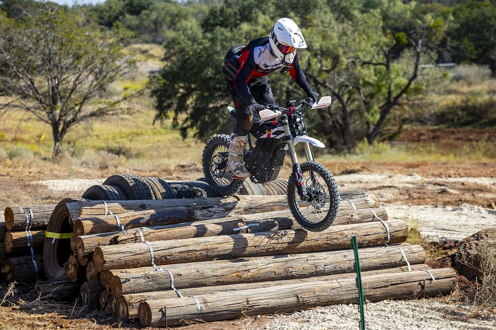 riding the Zero XB over obstacles made of telephone poles
