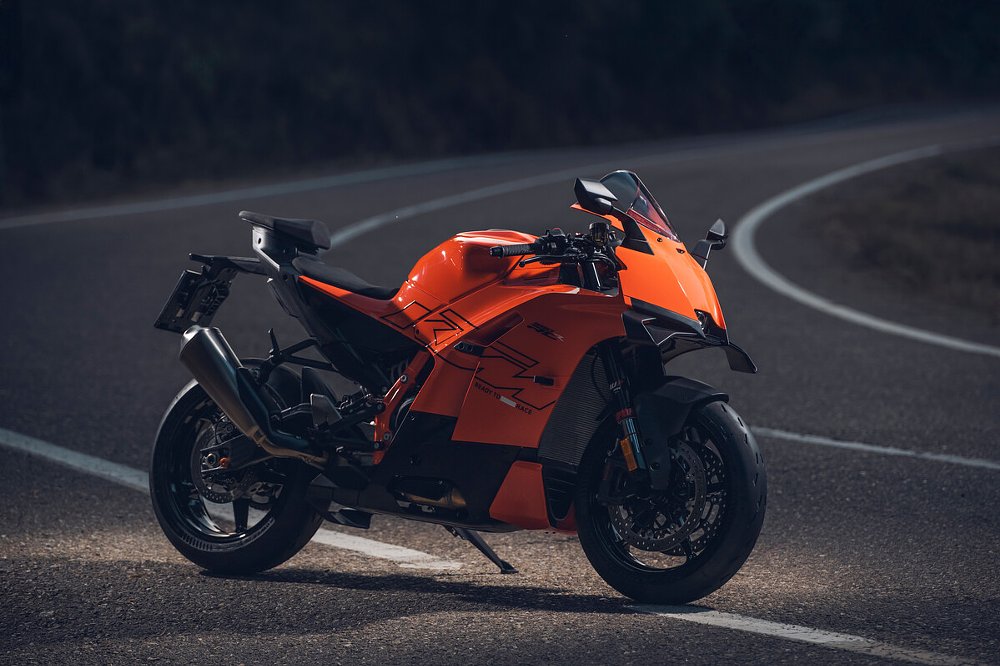 2026 KTM 990 RC R parked on the side of a road at dusk.