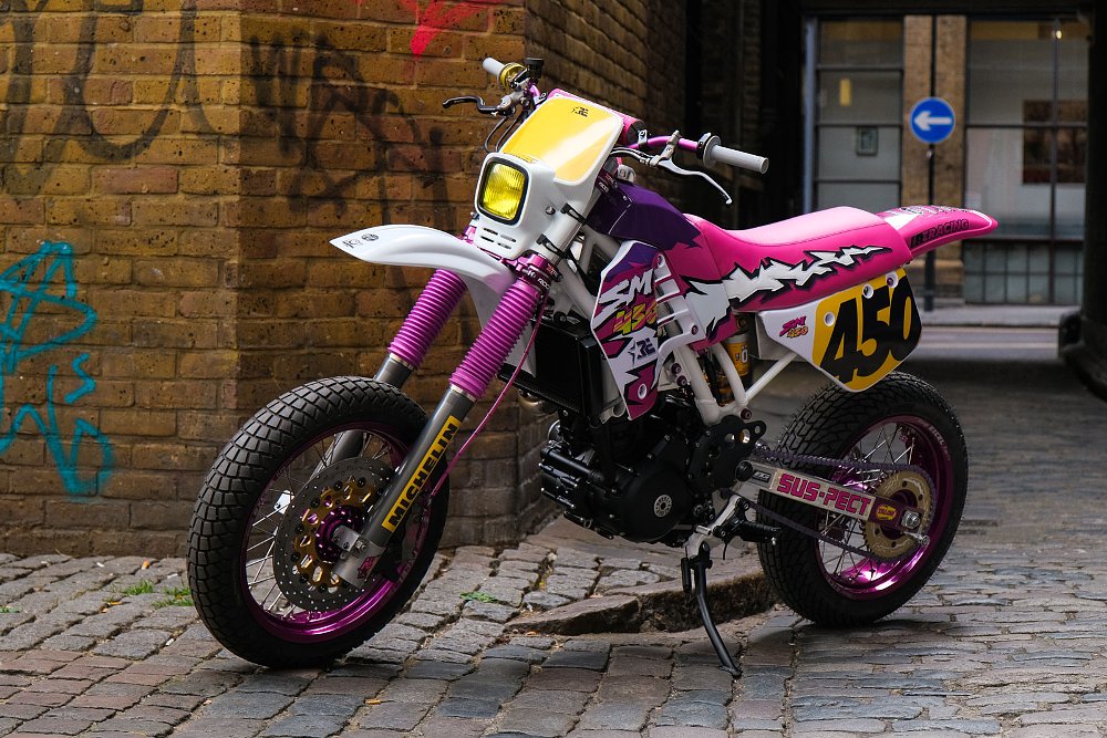 pink and purple themed single-cylinder motorcycle