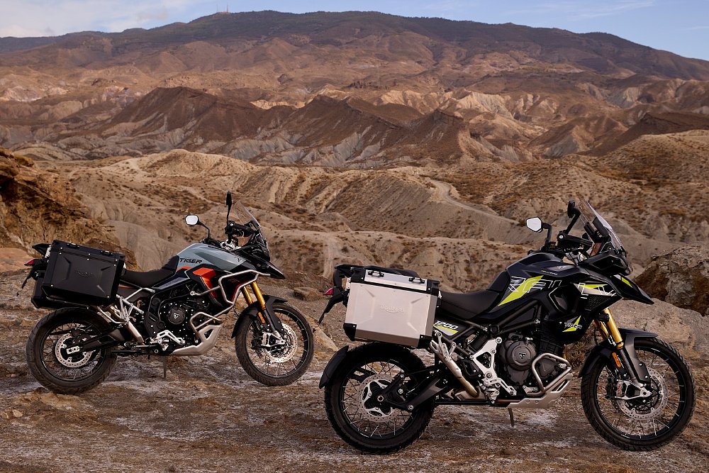The Triumph Tiger 900 Rally Pro Desert and Tiger 1200 Rally Pro Desert photographed on a desert plateau.