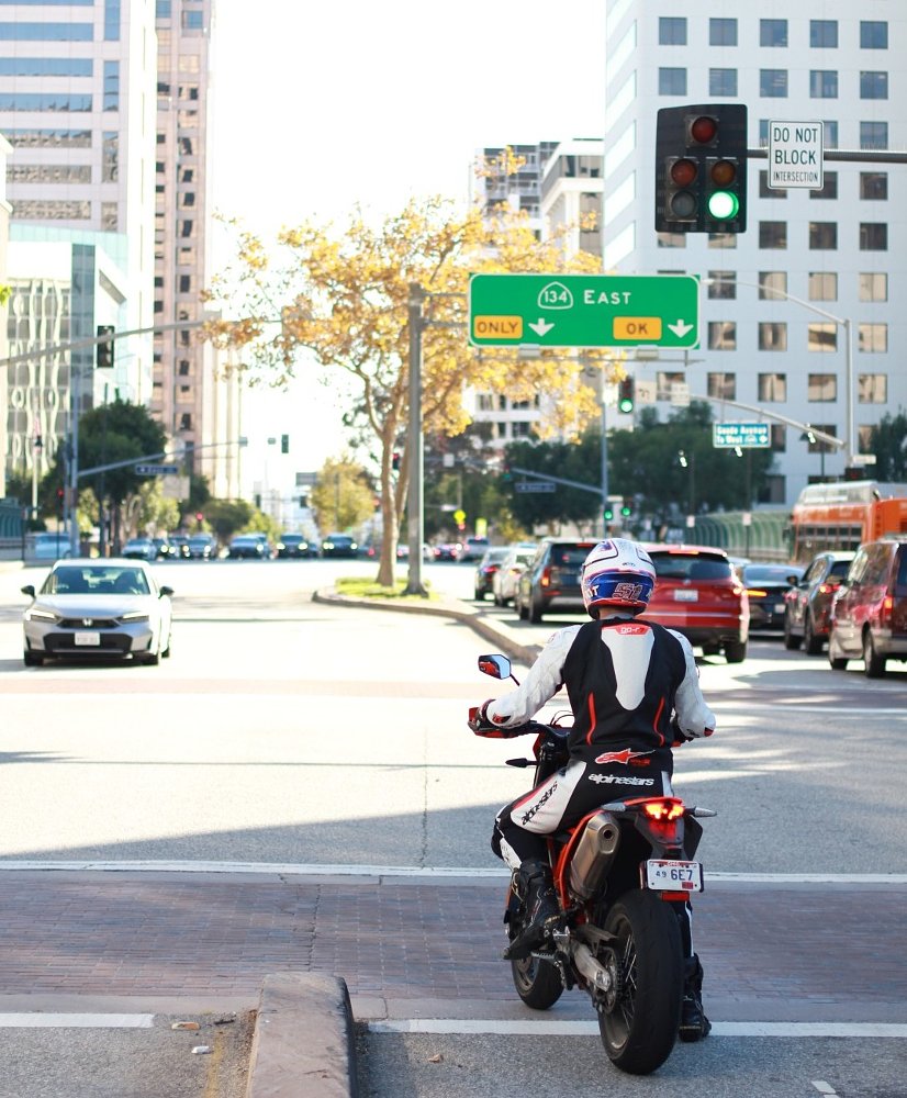 Dylan on the SMC R in city traffic at a stop light