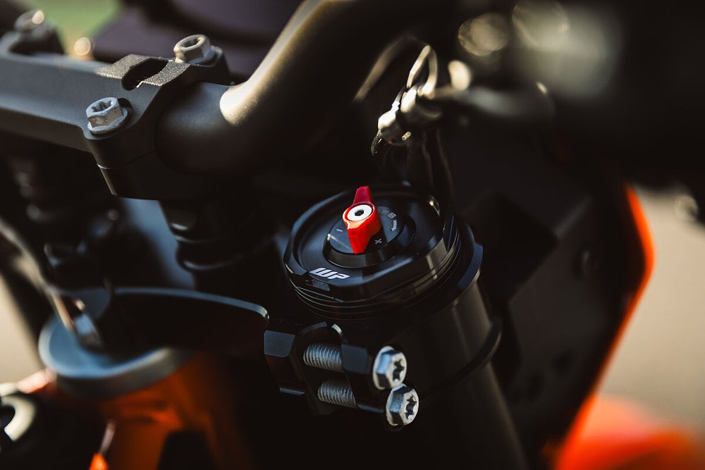 close view of the suspension adjuster on top of the fork leg