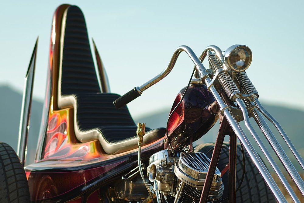 over view of the trike with large rear tires, multi-colored paint