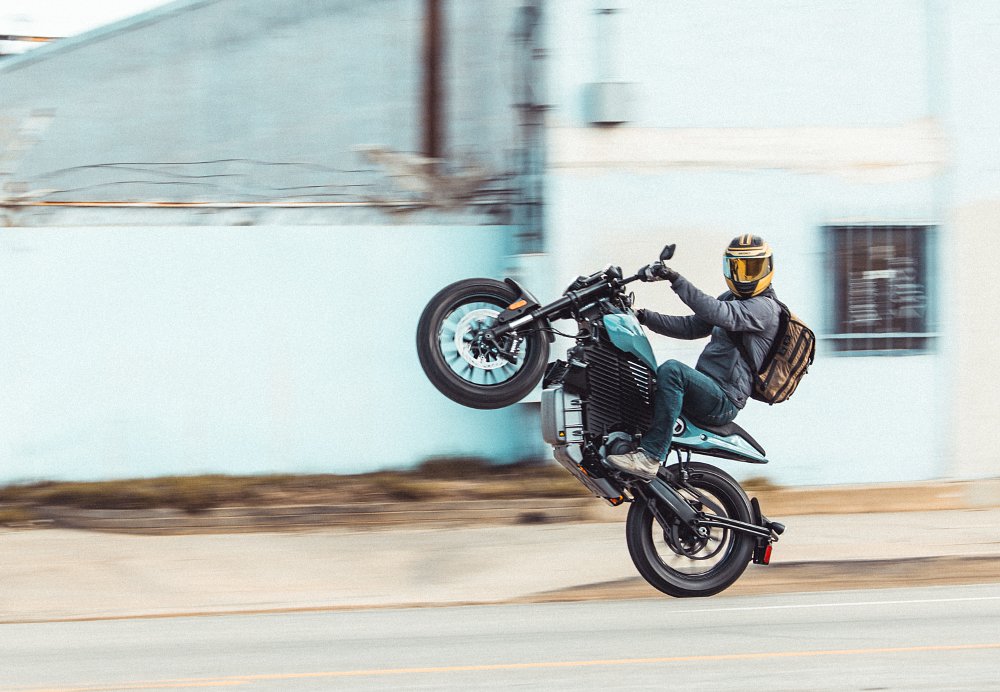 rider doing a wheelie on an electric S2 Del Mar