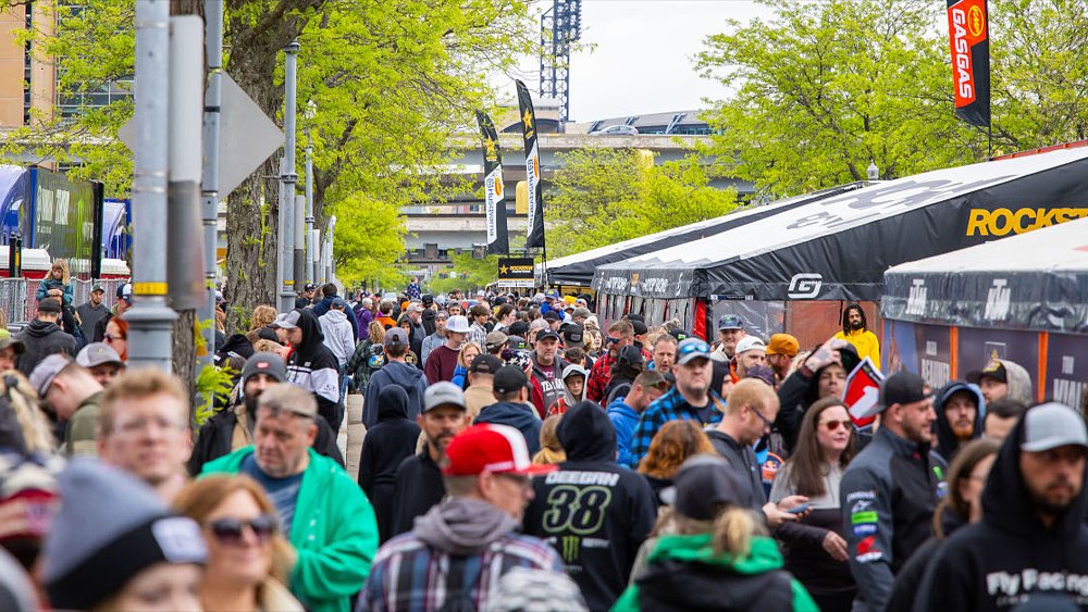 A horde of fans mill through the FanFest zone at a Supercross round.