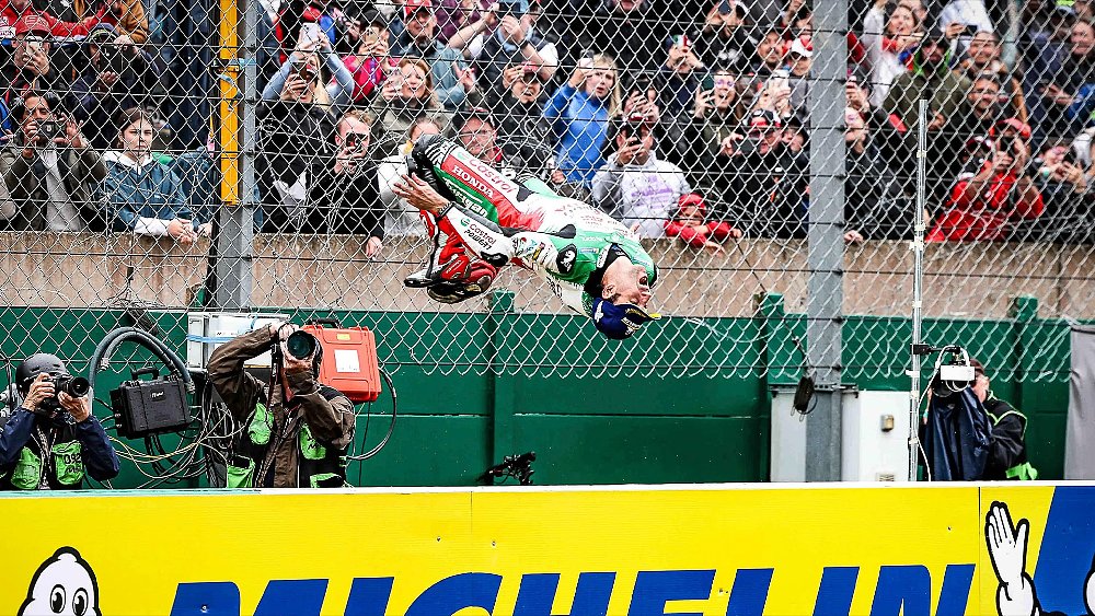 Honda MotoGP rider Johann Zarco performs a backflip in front of fans at Le Mans.