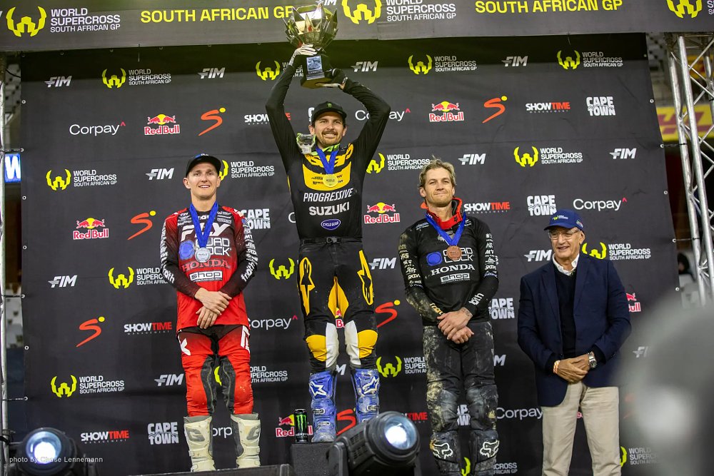 Jason Anderson raises the SX1 world championship trophy on the podium