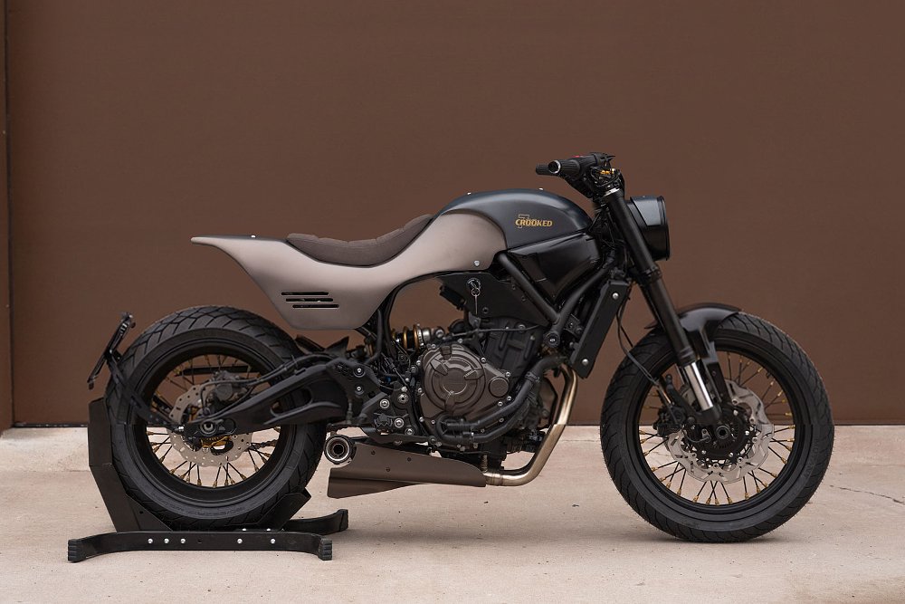 studio photo of the custom XSR700 in gray and bronze colors with a brown single seat