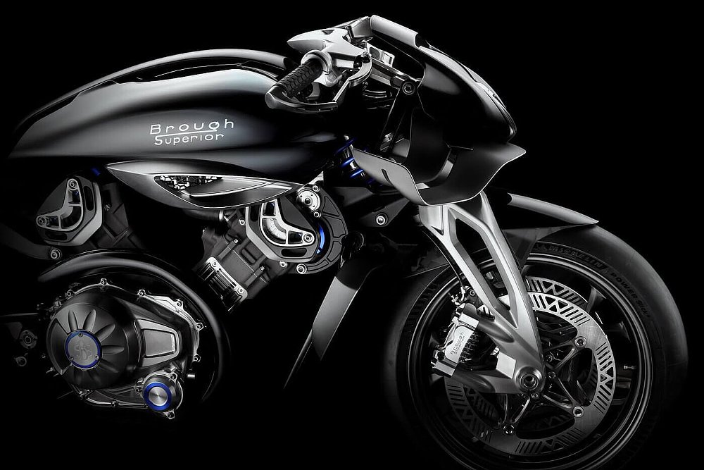 studio photo showing close view of the front end of the custom, with modern brakes, fairing with wings