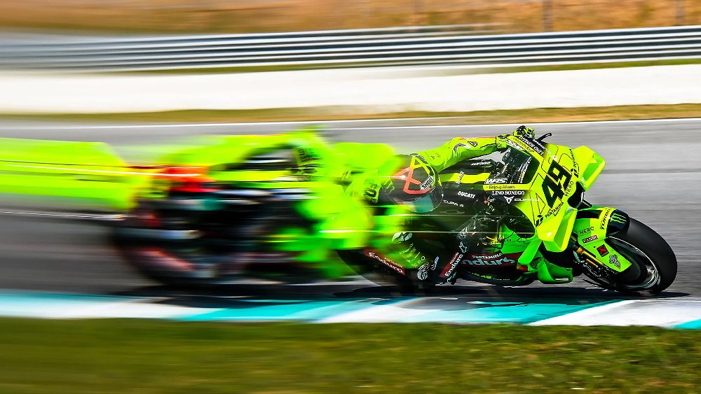 Fabio Di Giannantonio streaks past the cameras at Malaysia's Sepang International Circuit.