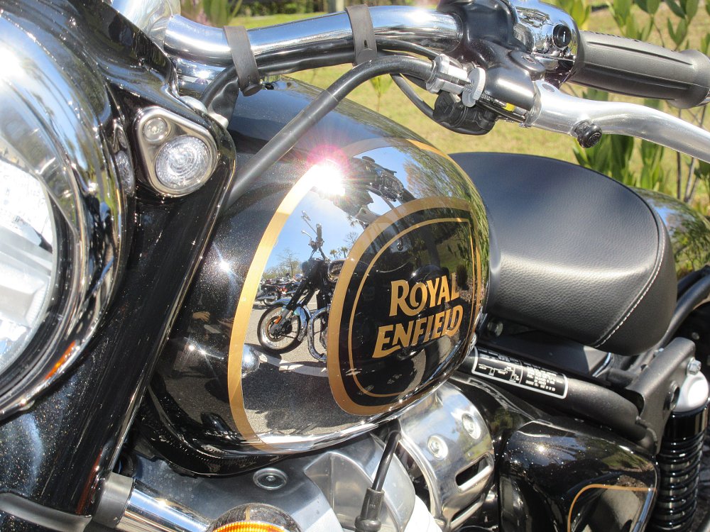 close view of the black and chrome fuel tank showing gold sparkle in the paint