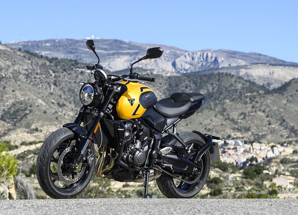left-side view of the Trident 660 parked along a curvy Spanish road