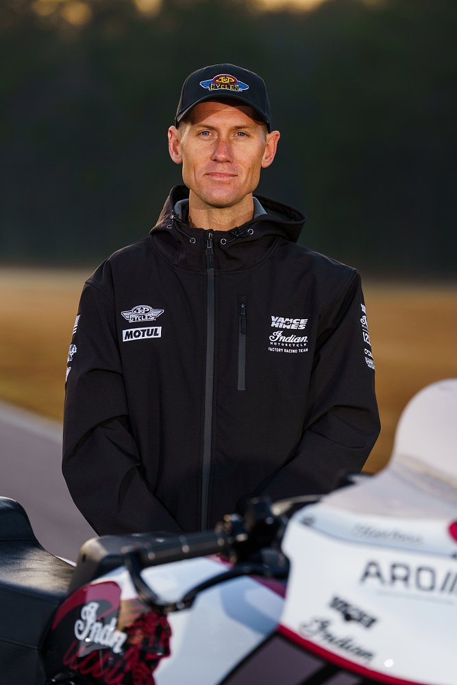 Troy Herfoss posing with his race motorcycle