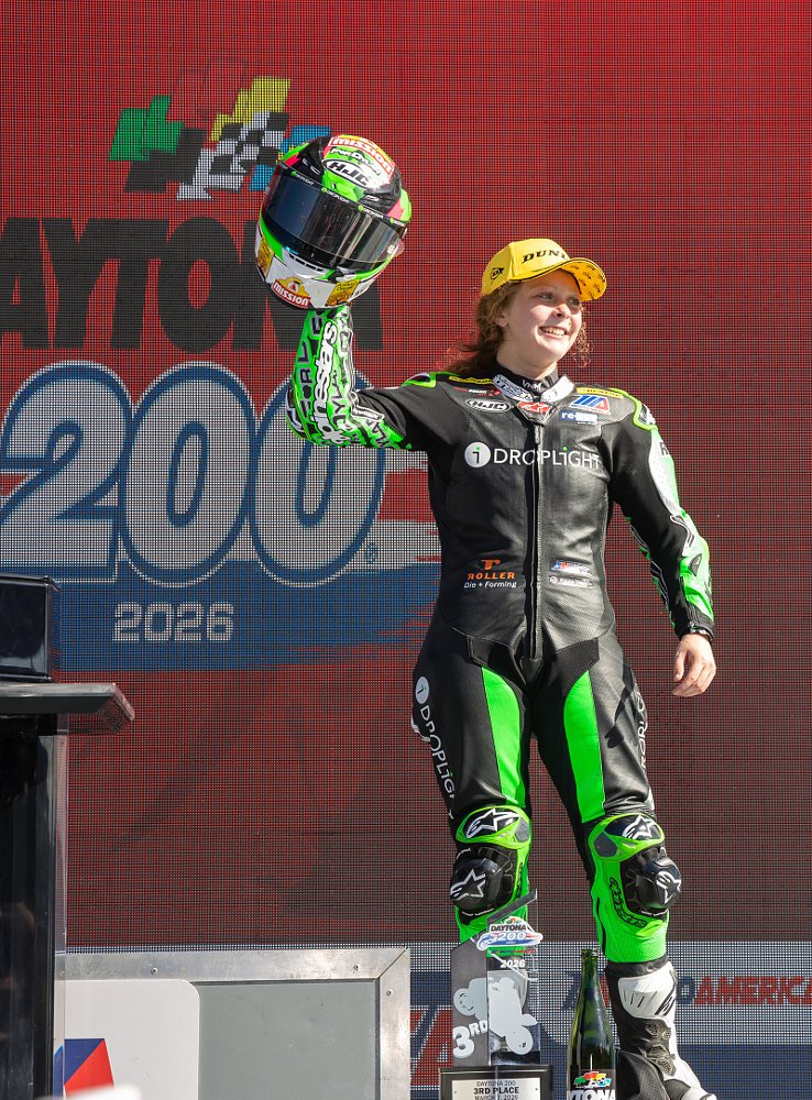 Kayla Yaakov celebrates her third-place finish after the race