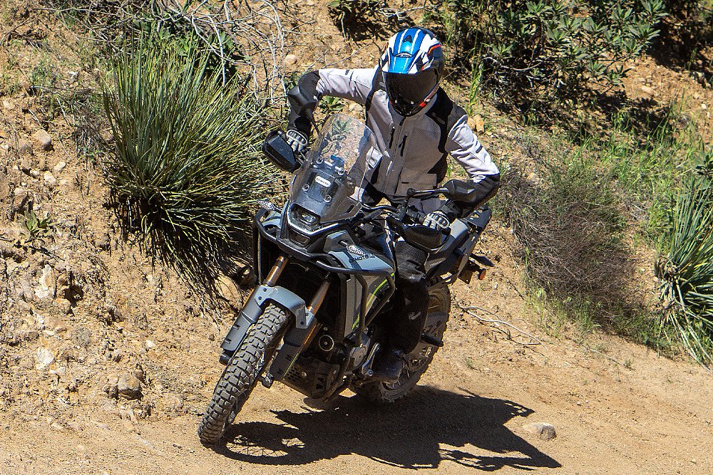 Dustin rides the Ibex 450 up the side of a hill.