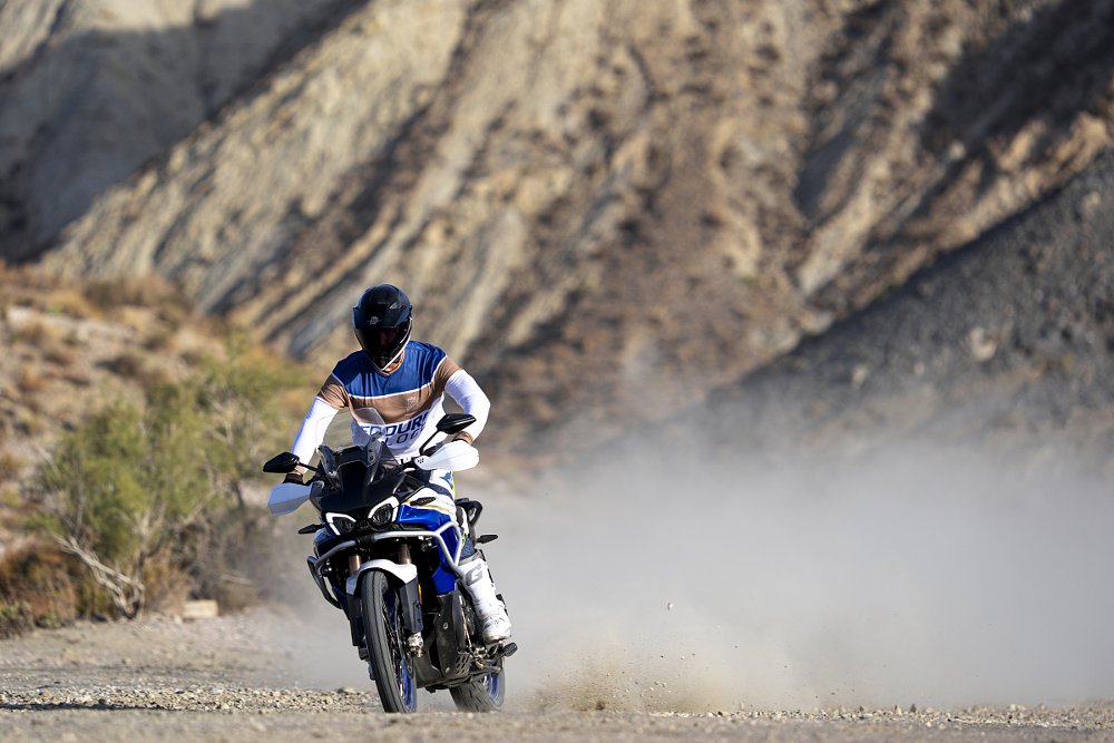 MV Agusta Enduro Veloce rider kicking up dirt on an unpaved road