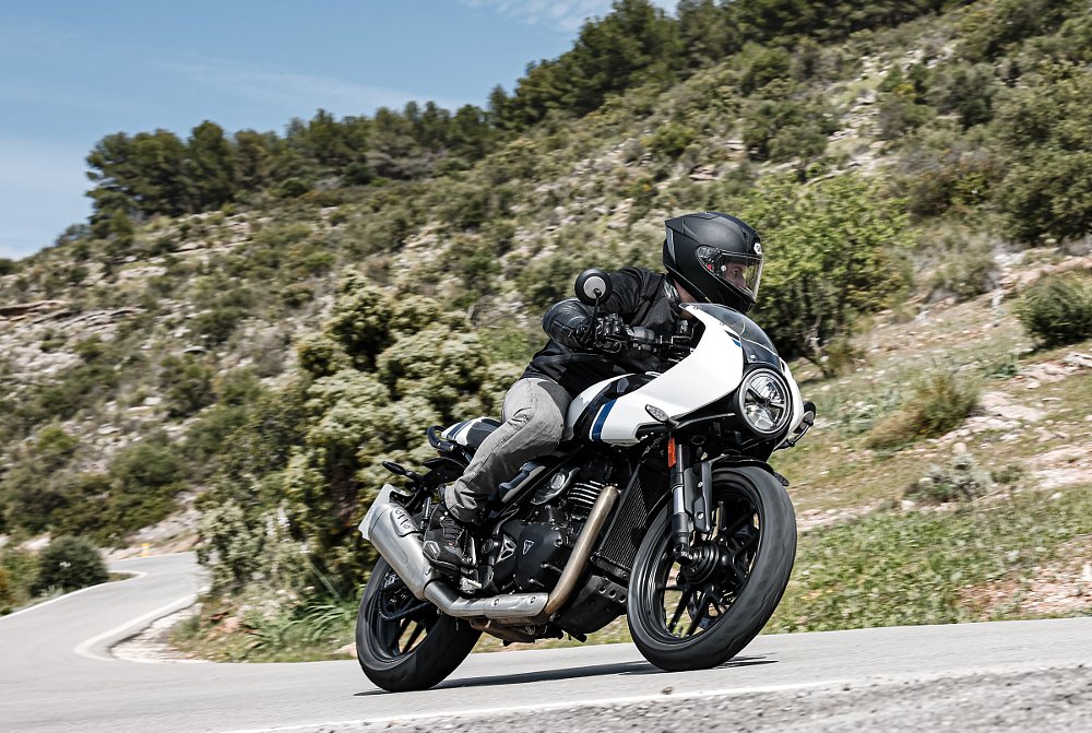 riding the white Thruxton on a mountain road in Spain, overhead view
