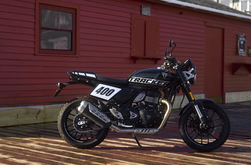 black Tracker 400 parked in front of a red building