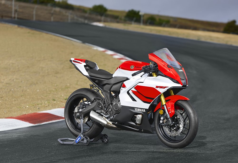 red and white R7 parked on a race track