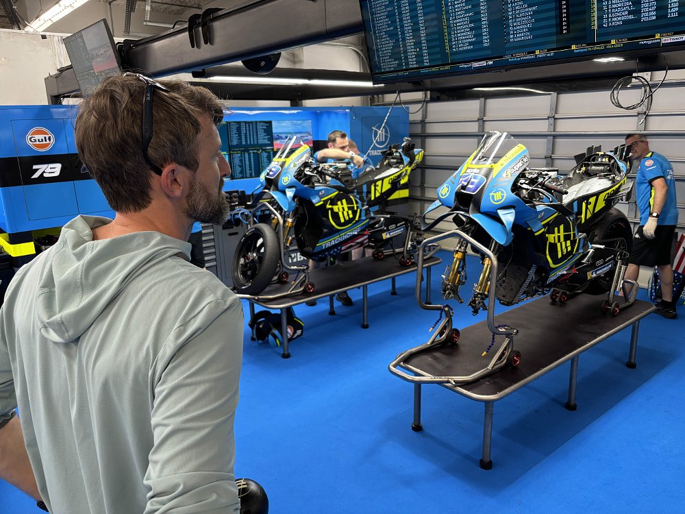 Zack Courts stands in the Trackhouse Aprilia Racing garage at the Red Bull Grand Prix of the Americas in Austin, Texas.