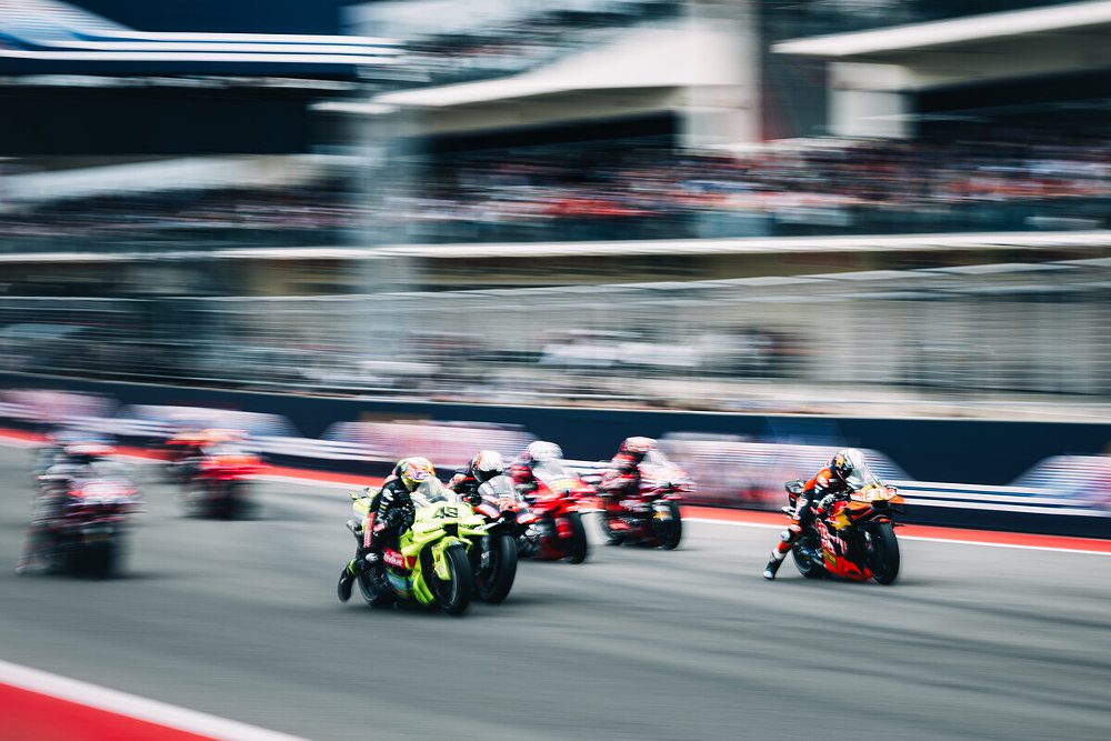 MotoGP machines sprint away from the starting line at the 2026 Red Bull Grand Prix of the Americas in Austin, Texas.