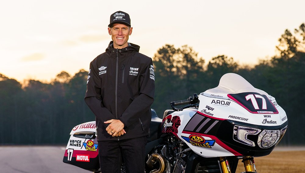 Herfoss poses with his Indian Challenger race bike at the track at sunset