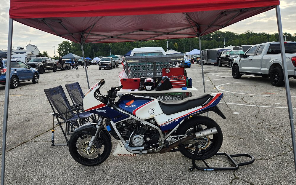red, white, and blue VF750F in the paddock, prepped for the track