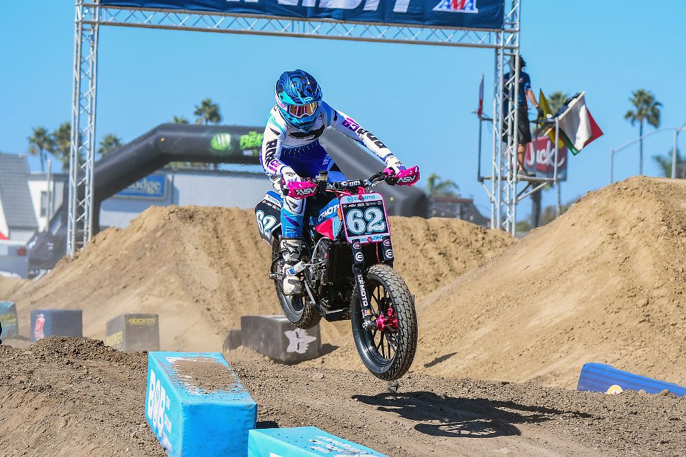 Andy DiBrino racing the CFMOTO flat-track race bike, flying over a jump