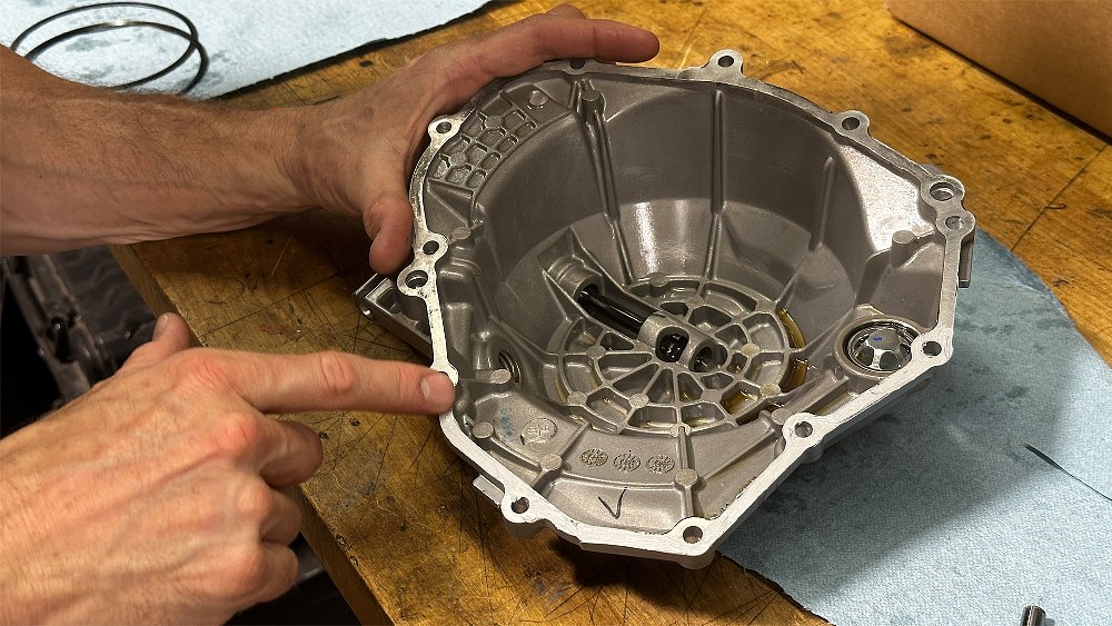 Ari Henning points to the edge of the Ibex 450's clutch cover.