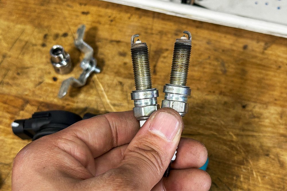 A close-up of the stock spark plugs pulled from the Ibex 450.