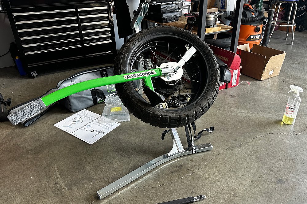 The Ibex 450's rear wheel mounted on a Rabaconda tire changer.