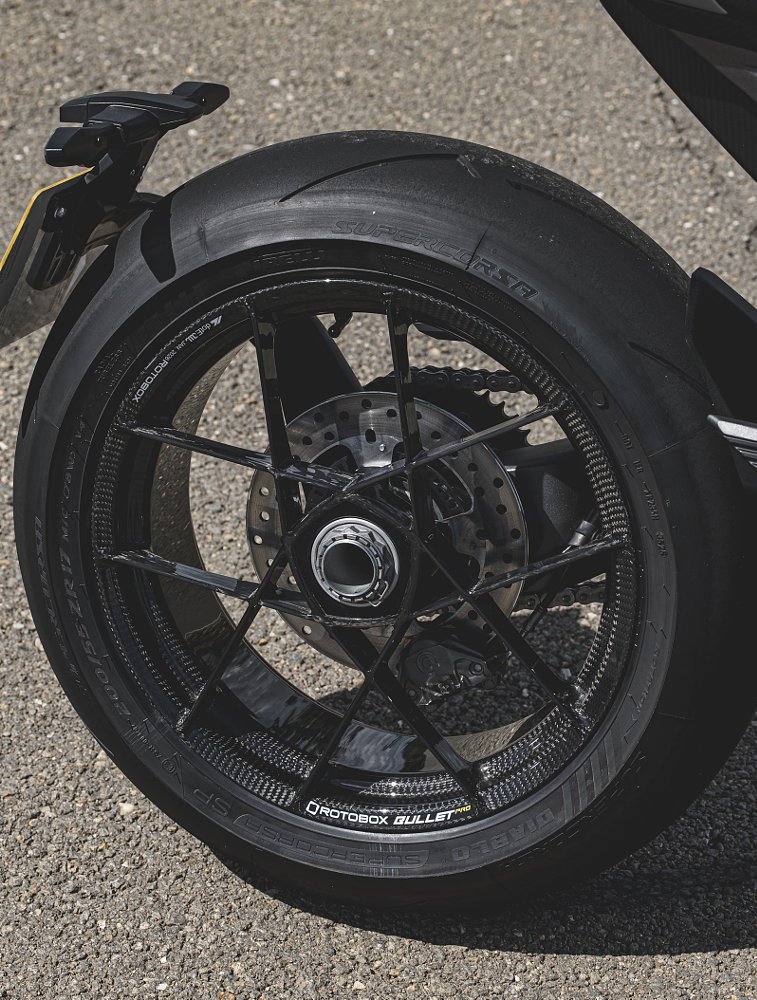 close view of the open side of the single-sided swingarm with the carbon fiber rear wheel