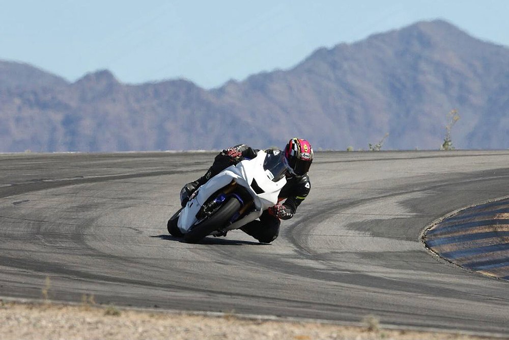 Jaime drags knee around a corner on the racetrack.