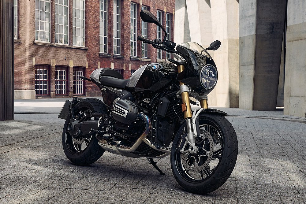 A fully accessorized R 12 NineT parked in an alley.