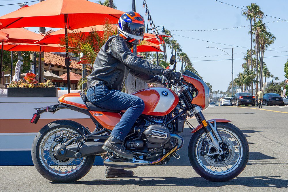 Dustin sitting on the R 12 S in an urban environment.