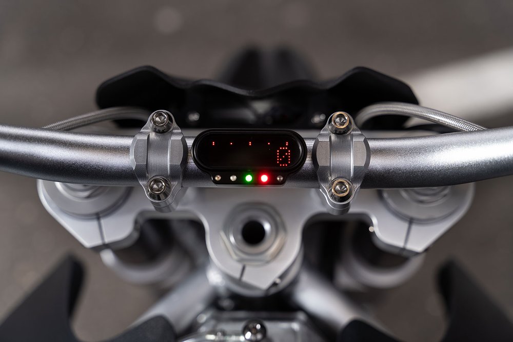 close view of tiny digital display on the top triple clamp