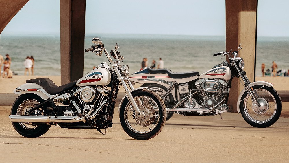 The 2026 Super Glide and 1971 FX Super Glide staged alongside a crowded beach.