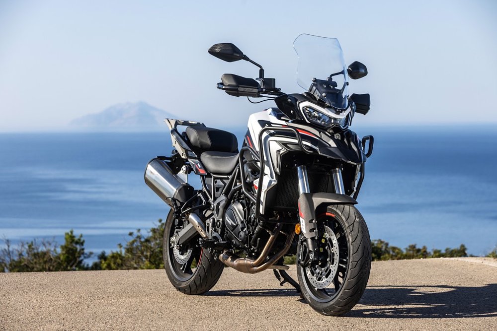 white with red stripes TRK 702 parked on an overlook above the sea