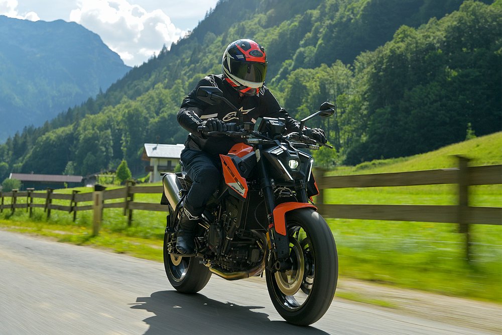 Dustin riding the 790 Duke through a valley in the Austrian Alps.
