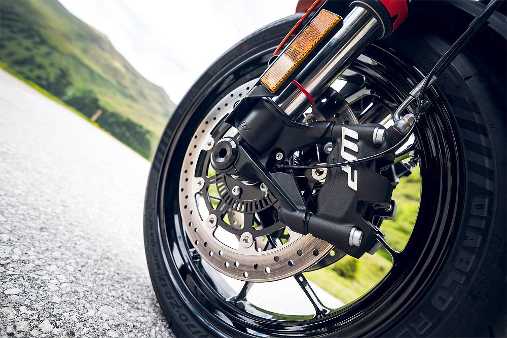 A close-up of the WP caliper on the 790 Duke's front wheel.