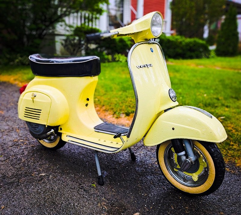 bright yellow vintage Vespa scooter