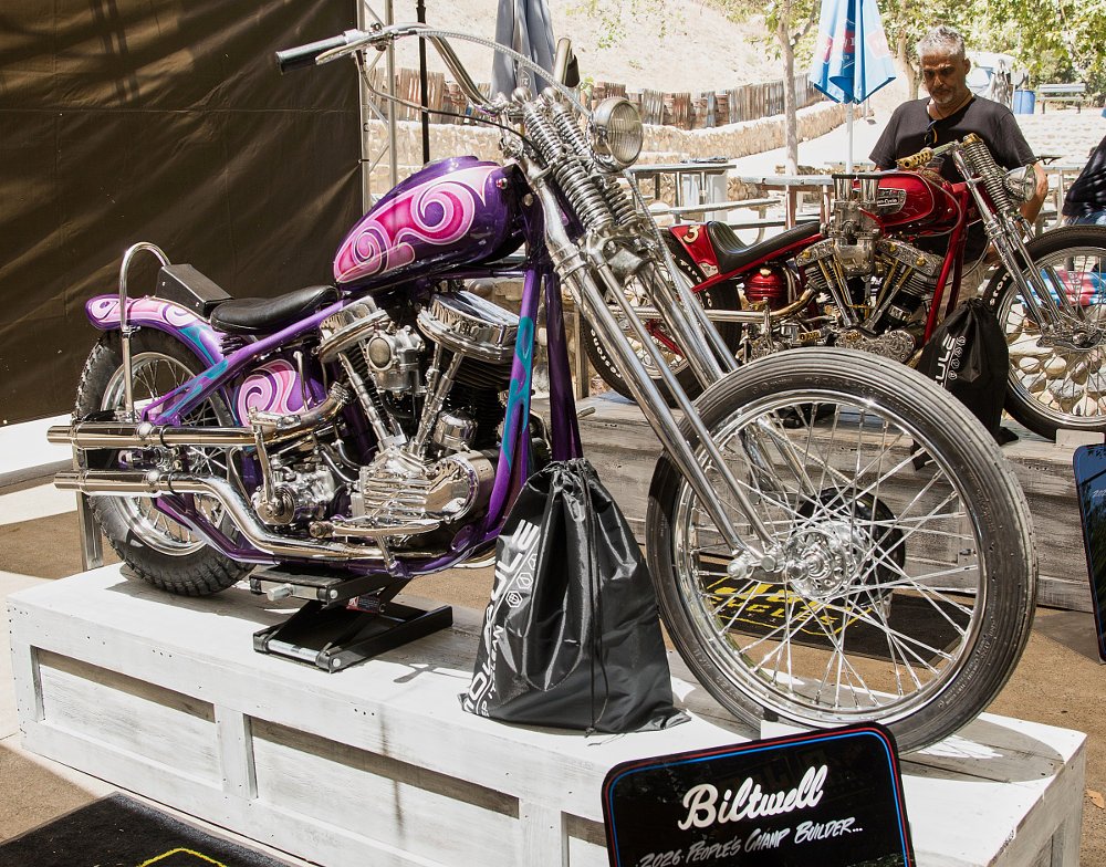 chopper with a springer front end and purple and pink swirl paint