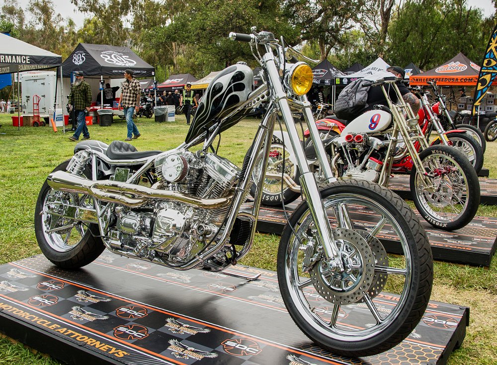 chopper with extended fork, dual front brakes, and black and silver flame paint on the peanut tank