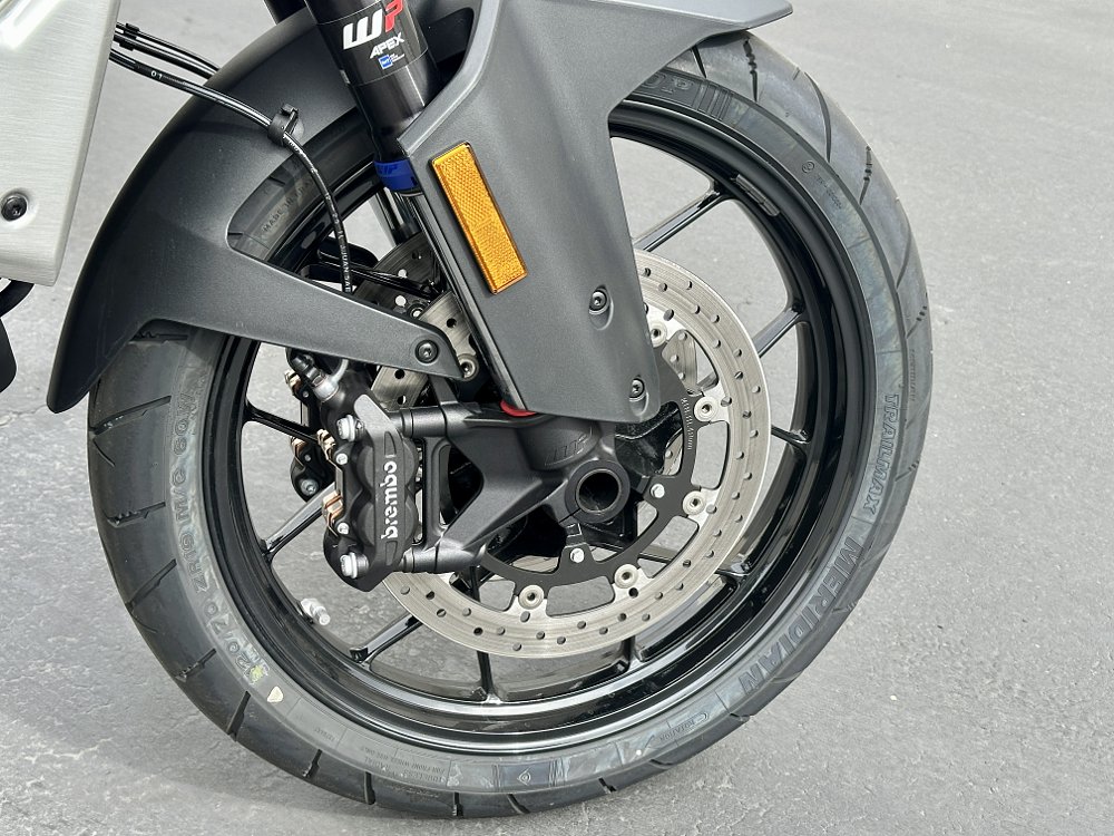 2027 KTM 1390 Super Adventure S EVO front wheel and brake detail.