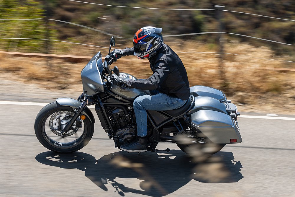 Dustin charges through a canyon road aboard the Rebel 1100T.