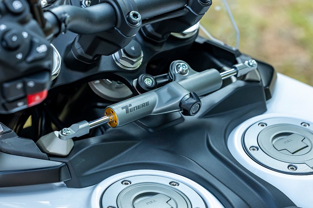 A close up of the World Raid's steering damper.