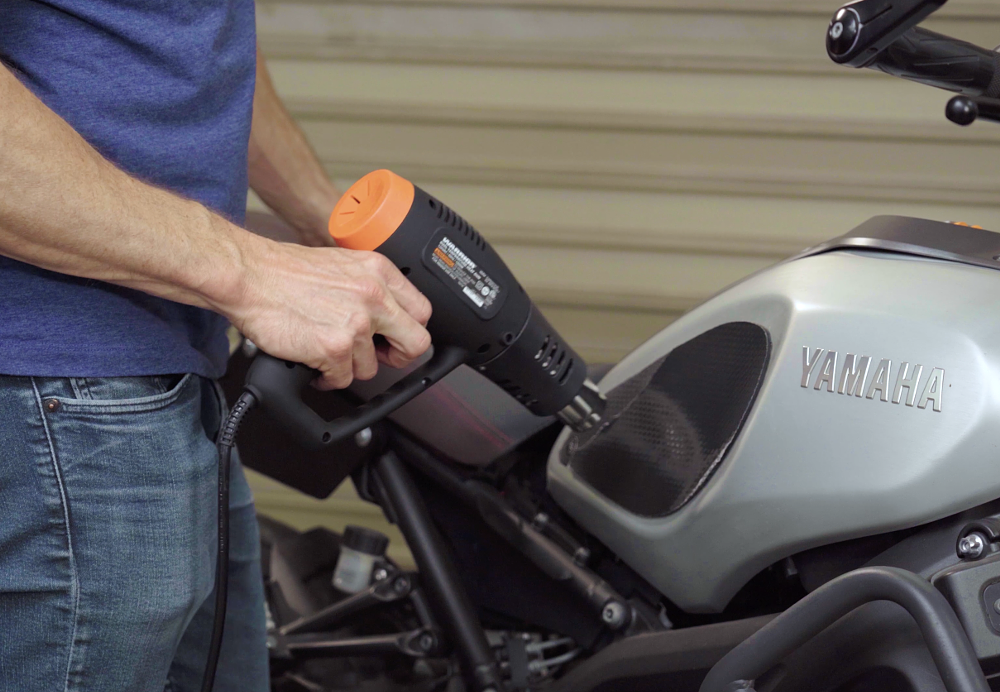 Heating old tank grips to assist with removal