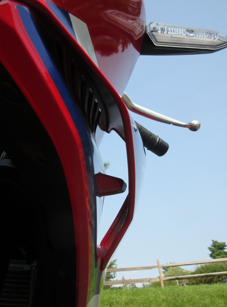 close view of the fairing, showing a small wing inside the air scoop