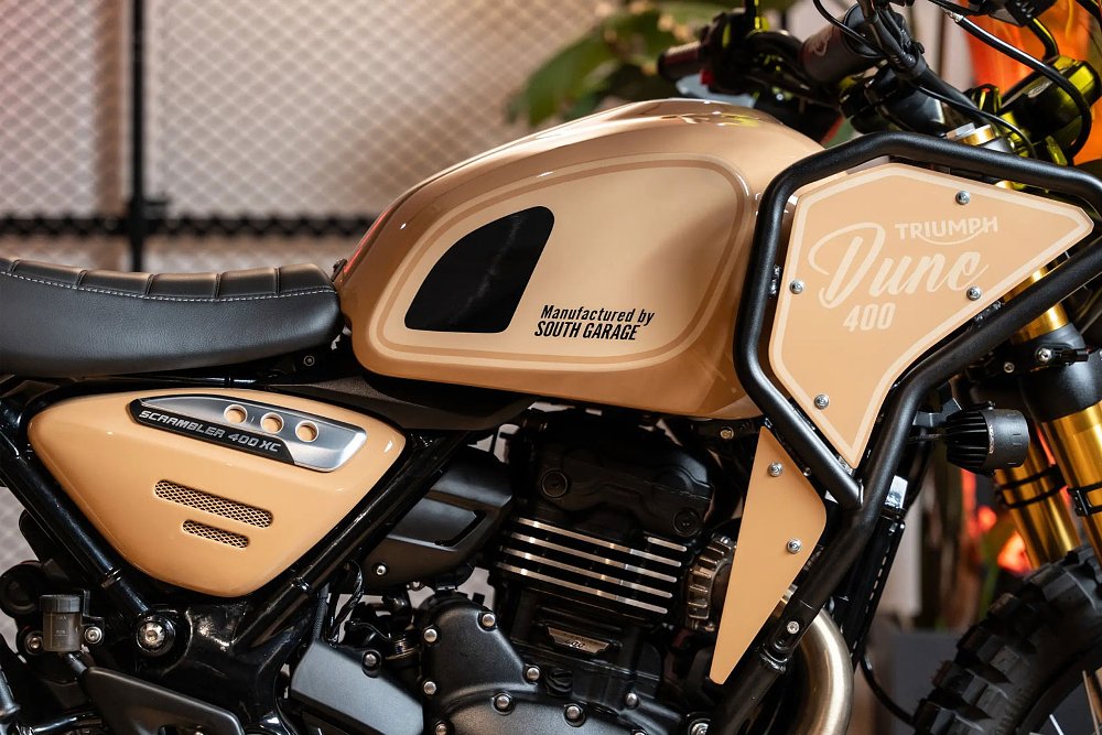 side view of the sand-colored tank and protective black crash bars