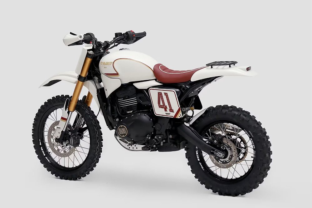 rear three-quarters view of the white, off-road styled motorcycle with reddish highlights